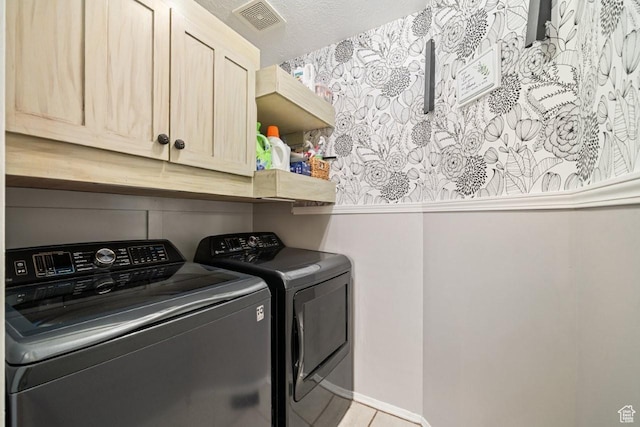 1458 N 2400 W, Clinton, UT 84015 - washroom with washer and dryer, cabinet space, and light tile patterned floors
