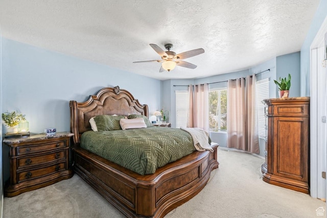 1458 N 2400 W, Clinton, UT 84015 - bedroom with light colored carpet, a textured ceiling, and ceiling fan