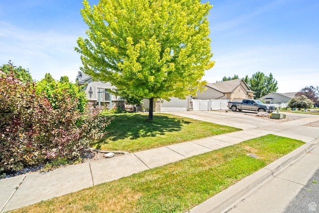 1458 N 2400 W, Clinton, UT 84015 - view of property hidden behind natural elements with a garage, a residential view, and driveway