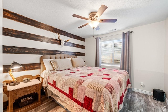1458 N 2400 W, Clinton, UT 84015 - bedroom featuring wood finished floors, a textured ceiling, and a ceiling fan