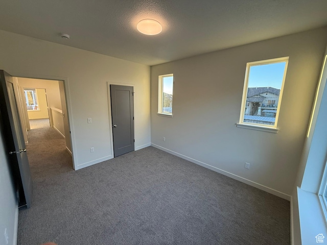 652 E 12225 S Unit 38, Draper, UT 84020 - unfurnished bedroom with dark carpet and freestanding refrigerator