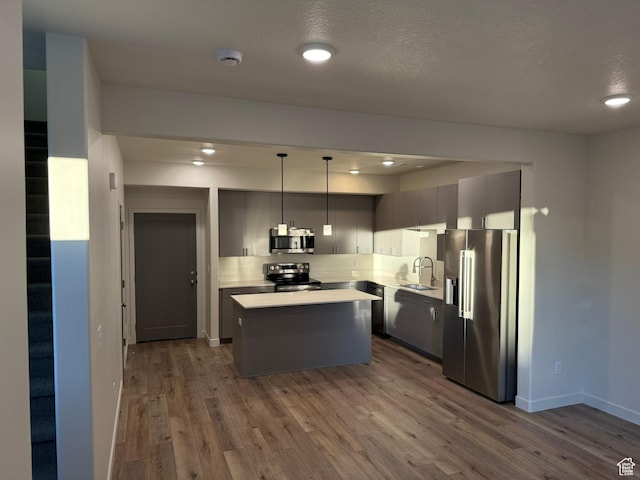 652 E 12225 S Unit 38, Draper, UT 84020 - kitchen with stainless steel appliances, dark wood-style floors, a kitchen island, light countertops, and recessed lighting