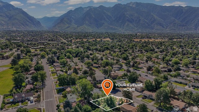 1469 E Winterwood Cir, Sandy, UT 84092 - aerial view of residential area with property parcel outlined and a mountainous background
