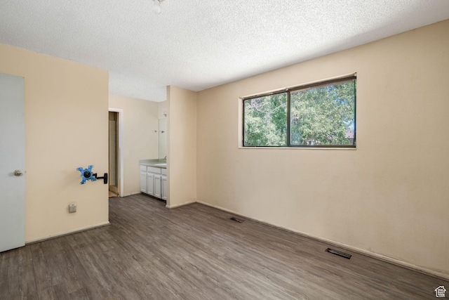 1469 E Winterwood Cir, Sandy, UT 84092 - spare room featuring wood finished floors and a textured ceiling
