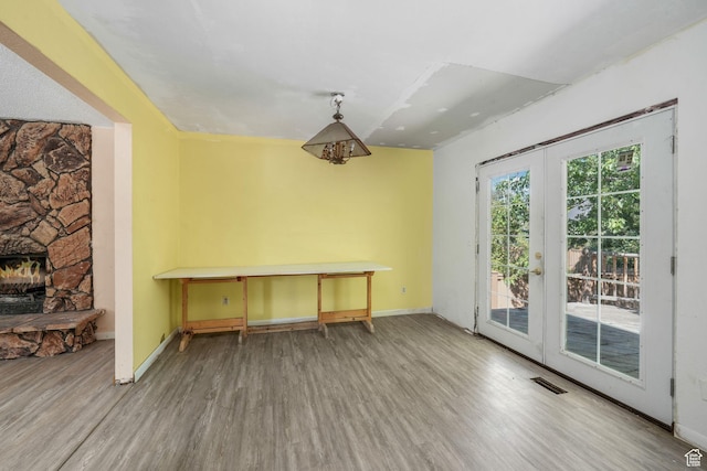 1469 E Winterwood Cir, Sandy, UT 84092 - dining area with wood finished floors, a fireplace, and french doors