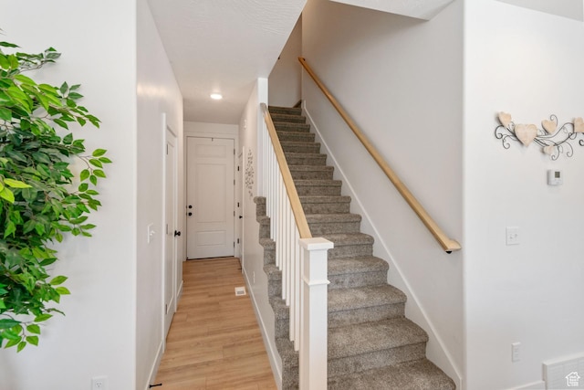 7310 N Green Pasture Ln, Eagle Mountain, UT 84005 - stairs with recessed lighting and wood finished floors