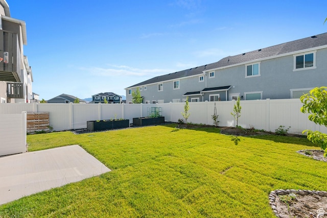 7310 N Green Pasture Ln, Eagle Mountain, UT 84005 - fenced backyard featuring a patio area and a residential view