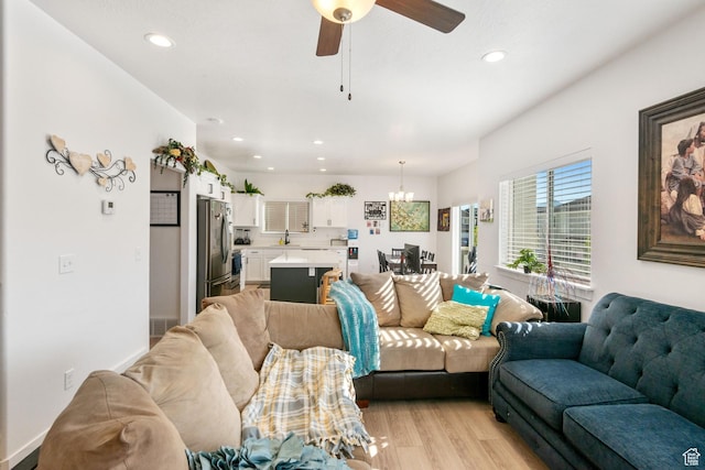 7310 N Green Pasture Ln, Eagle Mountain, UT 84005 - living area with light wood-type flooring, a chandelier, recessed lighting, and a ceiling fan