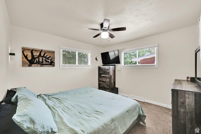 1634 N 350 W, Sunset, UT 84015 - carpeted bedroom featuring a ceiling fan and a baseboard heating unit
