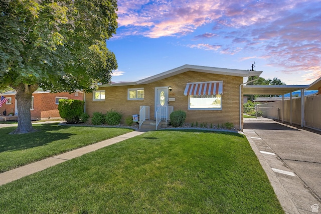 1634 N 350 W, Sunset, UT 84015 - ranch-style home with a carport, concrete driveway, and brick siding