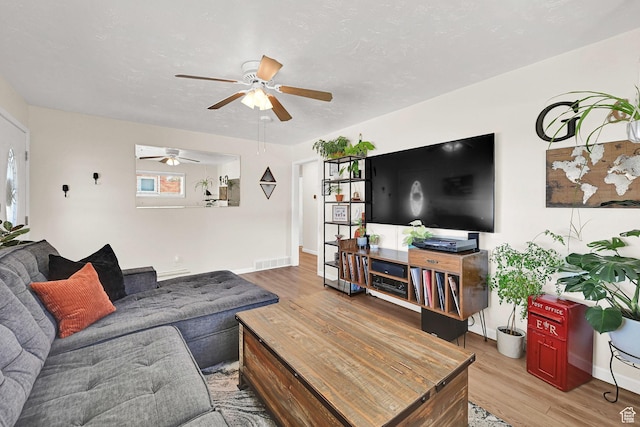 1634 N 350 W, Sunset, UT 84015 - living room featuring wood finished floors, ceiling fan, and healthy amount of natural light