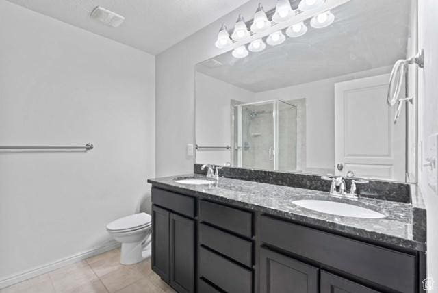 3057 S Finsbury Ln, West Valley City, UT 84120 - bathroom with a stall shower, double vanity, and tile patterned flooring
