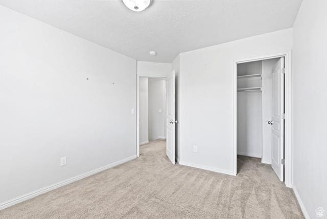3057 S Finsbury Ln, West Valley City, UT 84120 - unfurnished bedroom with light carpet and a spacious closet