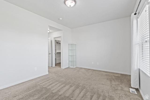 3057 S Finsbury Ln, West Valley City, UT 84120 - unfurnished bedroom with carpet flooring and a spacious closet
