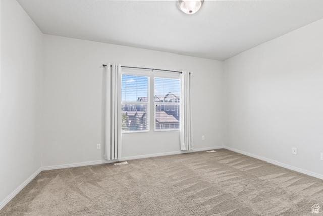 3057 S Finsbury Ln, West Valley City, UT 84120 - carpeted spare room featuring baseboards