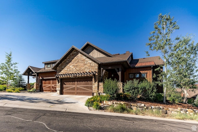 1658 E Viewside Cir, Hideout, UT 84036 - craftsman-style home with an attached garage, stone siding, board and batten siding, and concrete driveway