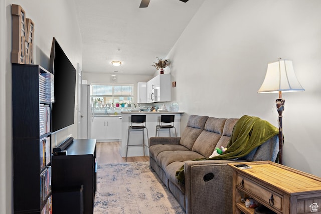1026 N 1090 W Unit 402, Orem, UT 84057 - living room with light wood-style floors and ceiling fan