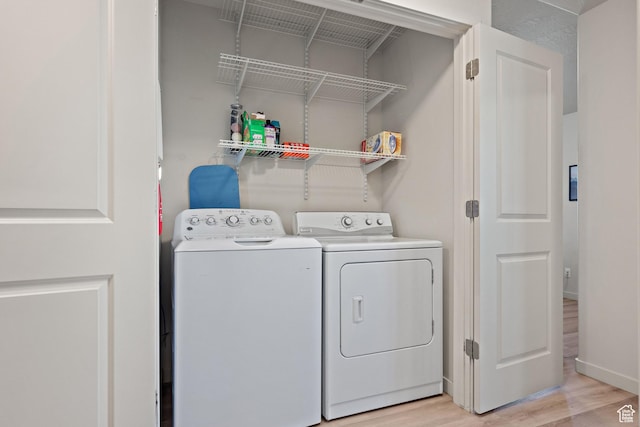 1026 N 1090 W Unit 402, Orem, UT 84057 - laundry room featuring washer and clothes dryer and light wood-style flooring