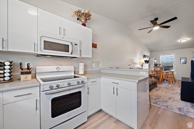 1026 N 1090 W Unit 402, Orem, UT 84057 - kitchen featuring white appliances, a peninsula, ceiling fan, tasteful backsplash, and light countertops