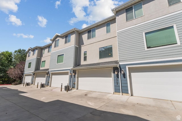 14764 S Rising Star Way W, Bluffdale, UT 84065 - view of front facade featuring a garage and stucco siding