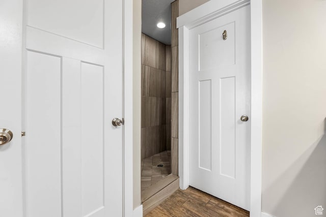 3973 E Eagle Top Ct, Eagle Mountain, UT 84005 - full bathroom with a tile shower and wood finished floors