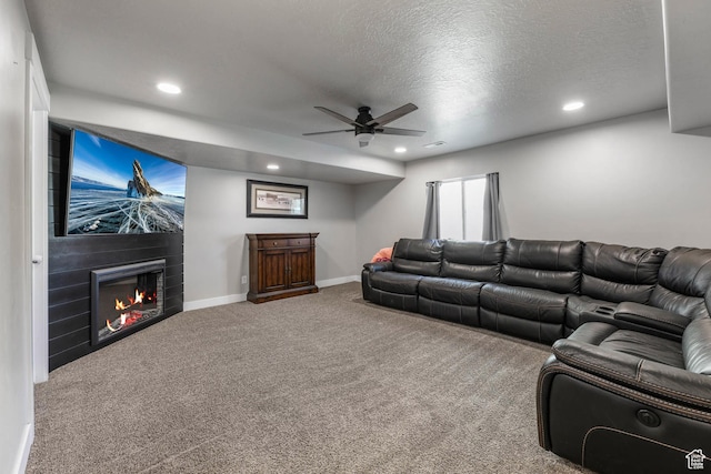 3973 E Eagle Top Ct, Eagle Mountain, UT 84005 - carpeted living room featuring ceiling fan, a fireplace, recessed lighting, and a textured ceiling