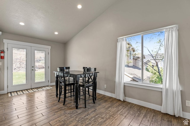 3973 E Eagle Top Ct, Eagle Mountain, UT 84005 - dining space with french doors, healthy amount of natural light, wood finished floors, vaulted ceiling, and recessed lighting