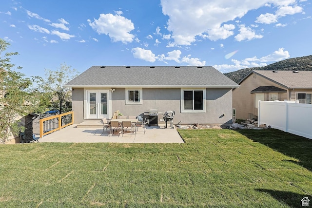 3973 E Eagle Top Ct, Eagle Mountain, UT 84005 - rear view of house featuring french doors, stucco siding, a patio, a fenced backyard, and a shingled roof