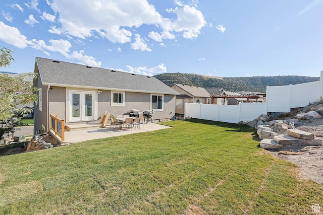 3973 E Eagle Top Ct, Eagle Mountain, UT 84005 - rear view of property with french doors, a patio, stucco siding, roof with shingles, and a mountain view