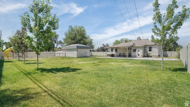 5398 S 2300 W, Roy, UT 84067 - fenced backyard with a patio area and an outdoor structure