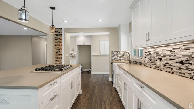 5398 S 2300 W, Roy, UT 84067 - kitchen with backsplash, dark wood-type flooring, white cabinets, pendant lighting, and recessed lighting