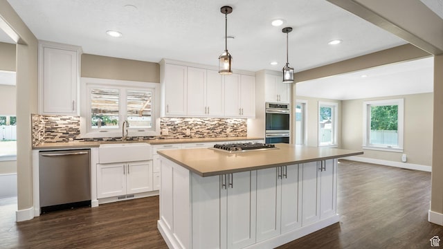 5398 S 2300 W, Roy, UT 84067 - kitchen with stainless steel appliances, tasteful backsplash, white cabinetry, dark wood-style flooring, and recessed lighting