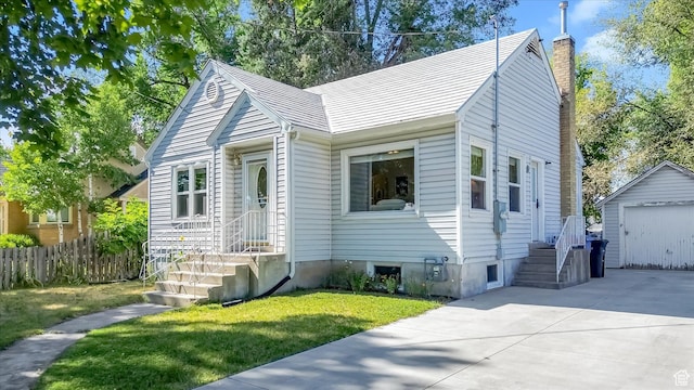 155 W 500 N, Logan, UT 84321 - bungalow-style home with a chimney, an outdoor structure, driveway, and a garage