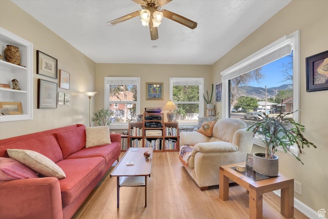 155 W 500 N, Logan, UT 84321 - living room featuring a ceiling fan and light wood-style floors