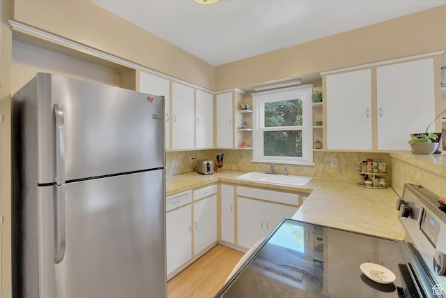 155 W 500 N, Logan, UT 84321 - kitchen with freestanding refrigerator, open shelves, range with electric stovetop, and light countertops