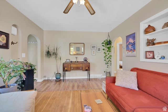 155 W 500 N, Logan, UT 84321 - living area featuring arched walkways, ceiling fan, and light wood-style flooring