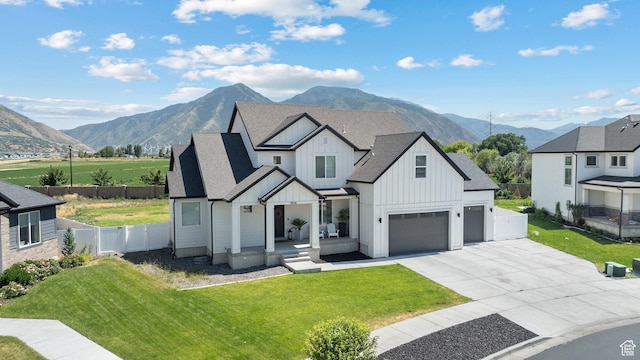 3056 E 80 S, Spanish Fork, UT 84660 - modern farmhouse featuring board and batten siding, a mountain view, roof with shingles, an attached garage, and concrete driveway