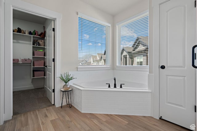 3056 E 80 S, Spanish Fork, UT 84660 - full bathroom with a garden tub, wood finished floors, plenty of natural light, and a walk in closet