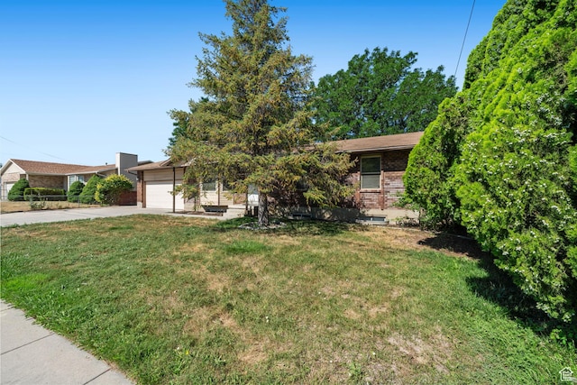 5608 S 700 W, Murray, UT 84123 - obstructed view of property with driveway, brick siding, an attached garage, and a front lawn