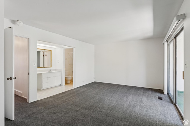 750 E Three Fountains Dr Unit 96, Murray, UT 84107 - unfurnished bedroom featuring carpet, multiple windows, connected bathroom, and a closet