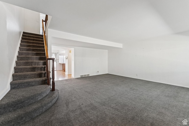 750 E Three Fountains Dr Unit 96, Murray, UT 84107 - unfurnished living room with stairway and carpet flooring