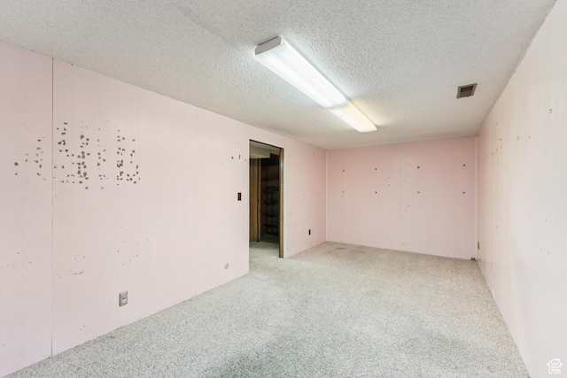 750 E Three Fountains Dr Unit 96, Murray, UT 84107 - empty room featuring light carpet and a textured ceiling