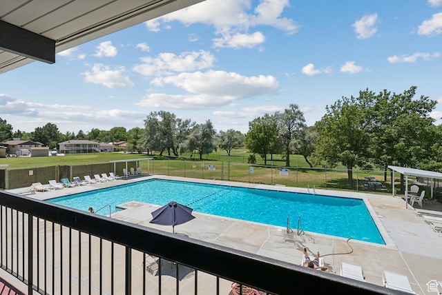 750 E Three Fountains Dr Unit 96, Murray, UT 84107 - community pool with a patio and view of wooded area