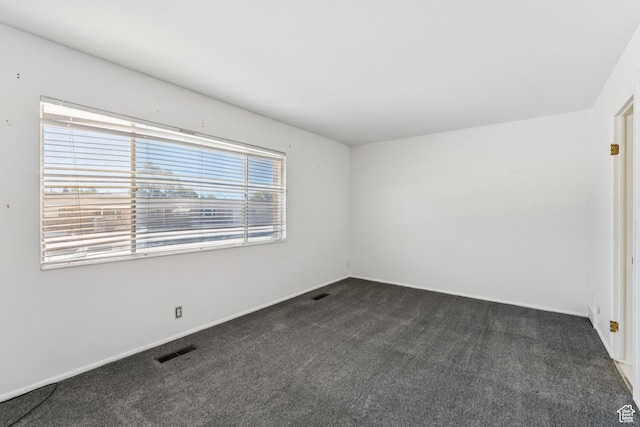 750 E Three Fountains Dr Unit 96, Murray, UT 84107 - spare room featuring dark carpet and baseboards