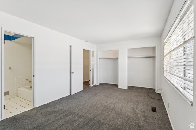 750 E Three Fountains Dr Unit 96, Murray, UT 84107 - unfurnished bedroom featuring two closets, carpet, and ensuite bathroom
