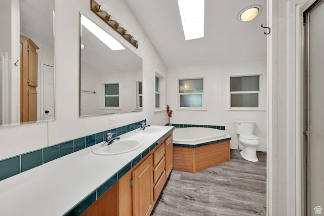 4171 W 2425 N, Hooper Davis Cnty, UT 84315 - full bath featuring double vanity, a bath, wood finished floors, and a skylight