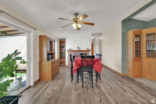 4171 W 2425 N, Hooper Davis Cnty, UT 84315 - dining area featuring a ceiling fan, light wood-type flooring, and vaulted ceiling