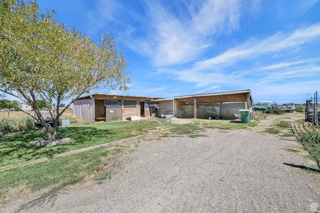 4171 W 2425 N, Hooper Davis Cnty, UT 84315 - view of front of home with driveway, an outdoor structure, and a carport