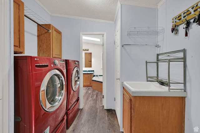 4171 W 2425 N, Hooper Davis Cnty, UT 84315 - washroom with cabinet space, washing machine and clothes dryer, crown molding, and wood finished floors