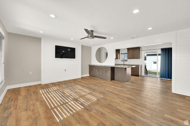 648 W Porter Ln, Centerville, UT 84014 - unfurnished living room with light wood-type flooring, recessed lighting, and a ceiling fan